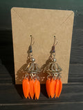 Orange pedal ear rings